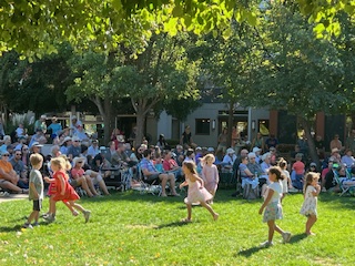 children running on the green at Pops 2024